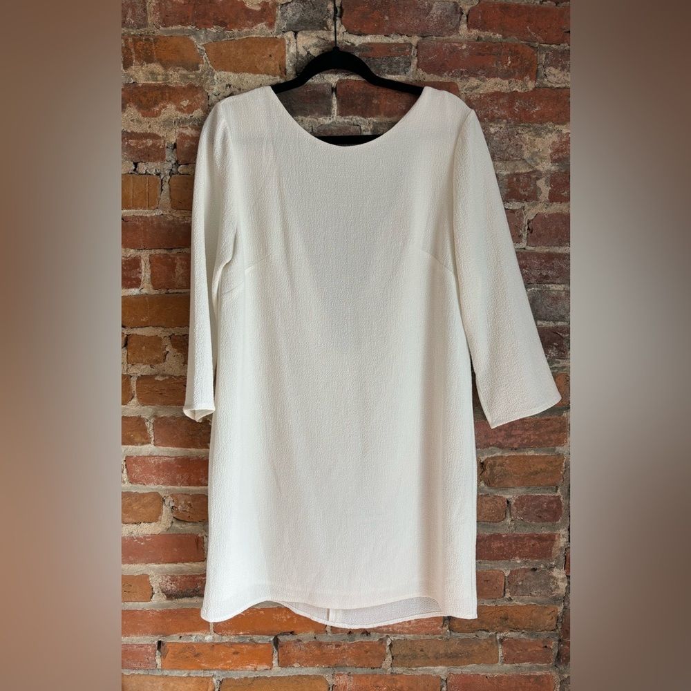 Bridal White mini dress with low back. Never worn, size medium/ 6-8